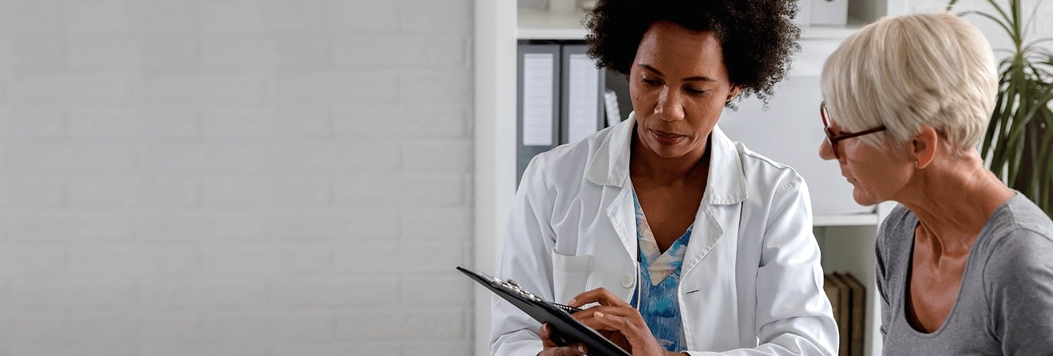 Female doctor talking to a female patient