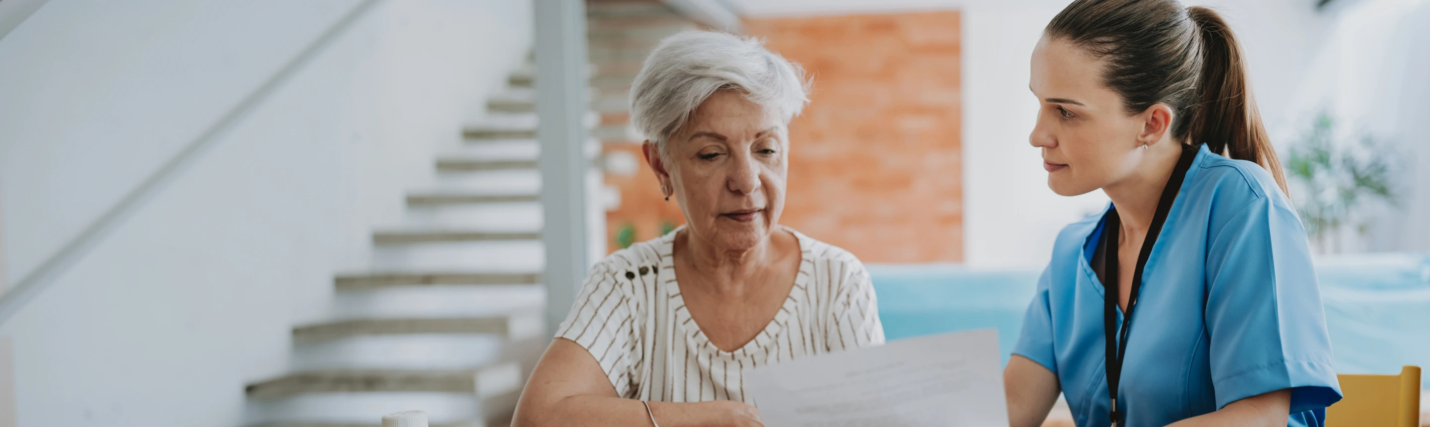 Image of two women looking pensive